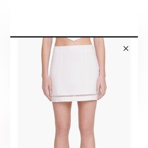 STAUD Tori White Linen Mini Skirt. This skirt runs a little small. NWT